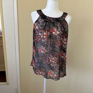 Floral print black sheer blouse.